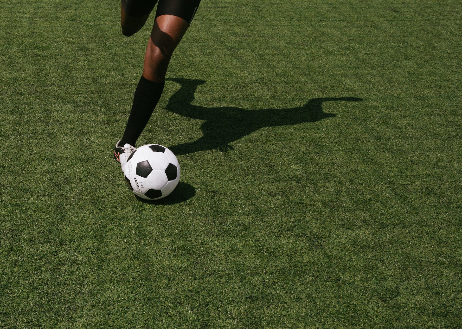 Football player kicking ball